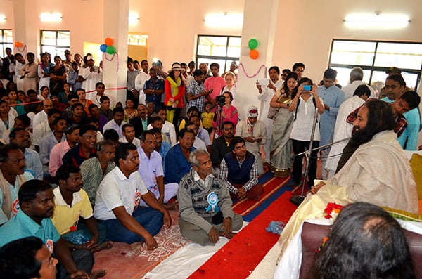 Gurudev interacts with villagers at the community center